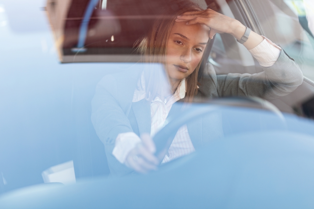young-businesswoman-feeling-annoyed-while-driving-car-being-stuck-traffic-jam-view-is-through-glass.jpg